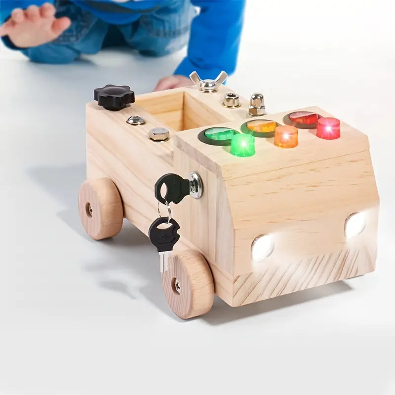 Montessori activiteitenbord "Klikker" met verschillende gereedschap-achtige elementen voor sensorisch spel en motoriek.