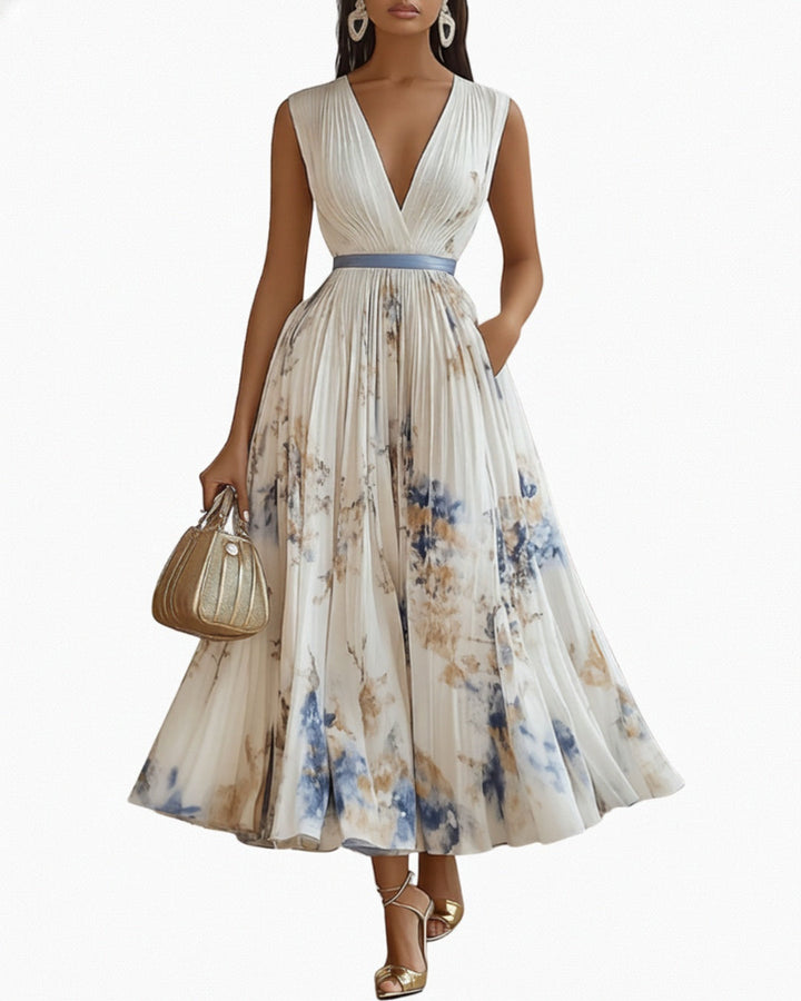 Mouwloze maxi jurk voor dames met v-hals en elegante plissé A-lijn. Perfect voor de zomer.