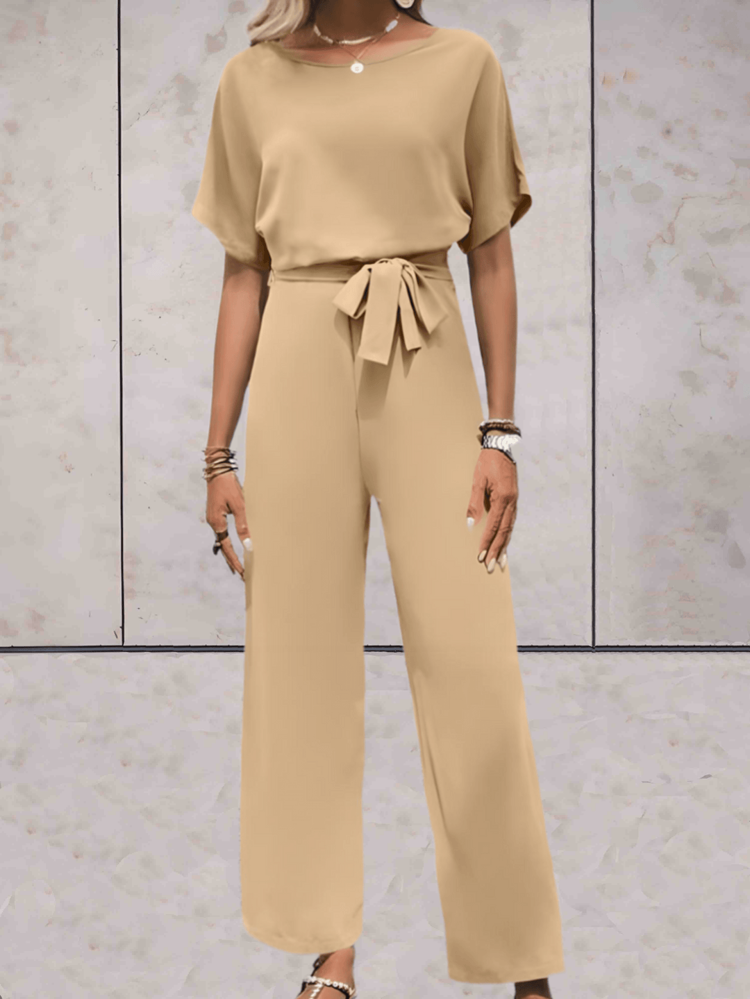 "Noa jumpsuit dames, stijlvol en comfortabel, wijde mouwen, striklinten, ademende stof, chic en veelzijdig."