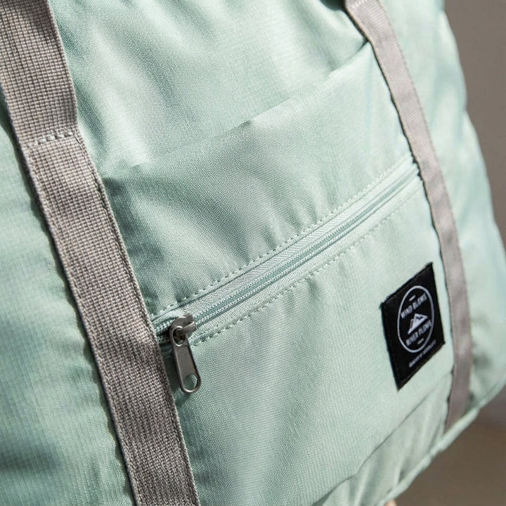 Duurzame, waterdichte FoldLite weekendtas. Perfecte opvouwbare duffelbag voor zorgeloos reizen.