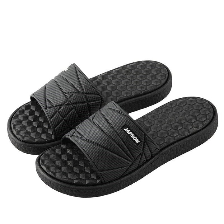 Orthopedische herenslippers met ademend bovenwerk en comfortabel voetbed, ideaal voor thuis en buiten.