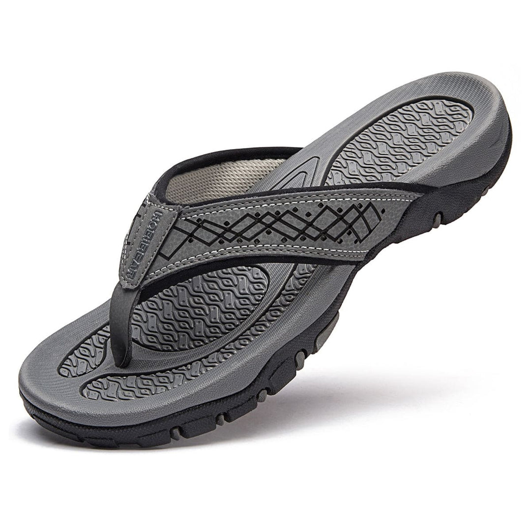 Orthopedische herenslippers met ademend bovenwerk en comfortabel voetbed, ideaal voor thuis en buiten.
