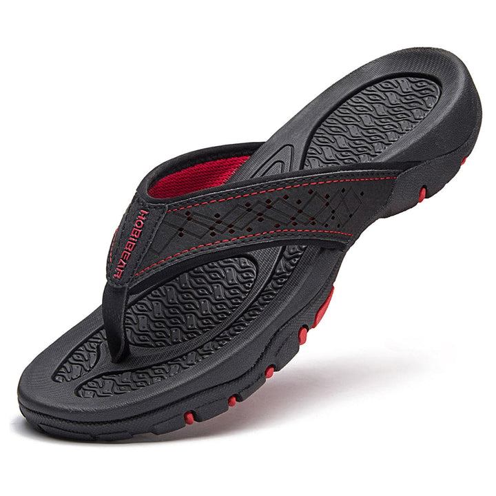 Orthopedische herenslippers met ademend bovenwerk en comfortabel voetbed, ideaal voor thuis en buiten.
