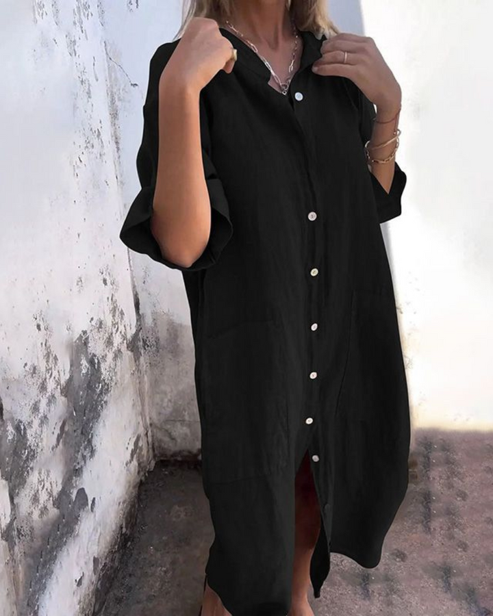 Modieuze dames tuniekjurk, oversized midi model met knoopsluiting en trendy zijsplit voor de zomer.