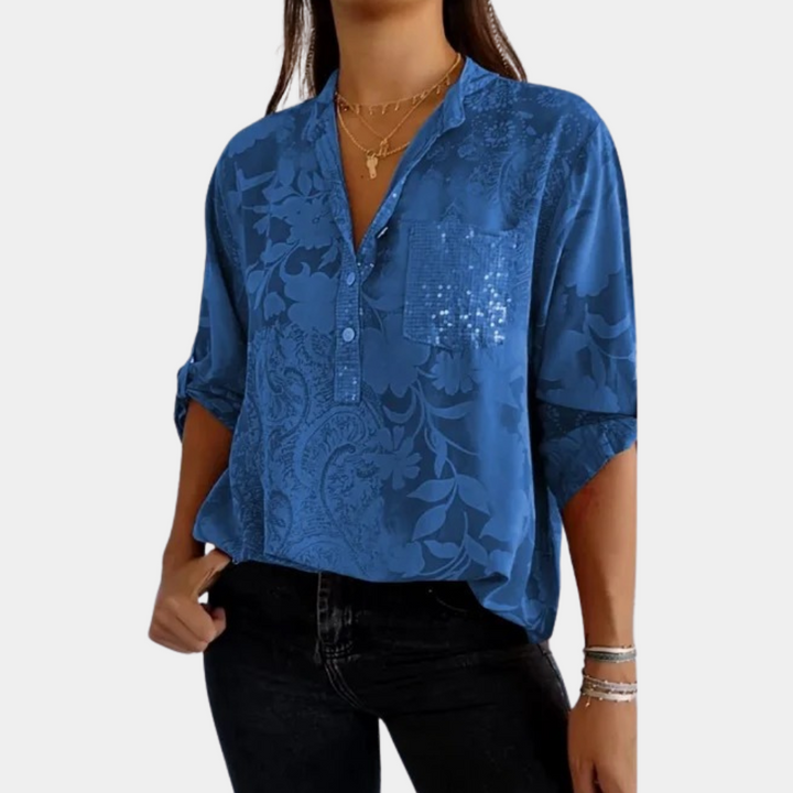 "Paarse damesblouse met bloemenpatroon en verstelbare mouwen voor veelzijdige, stijlvolle look."