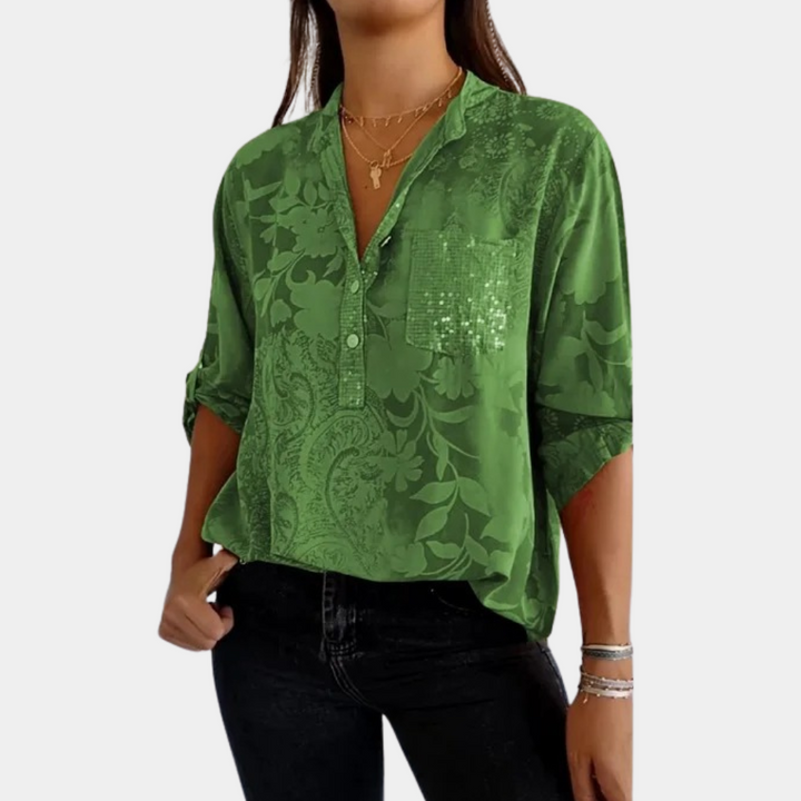 "Paarse damesblouse met bloemenpatroon en verstelbare mouwen voor veelzijdige, stijlvolle look."