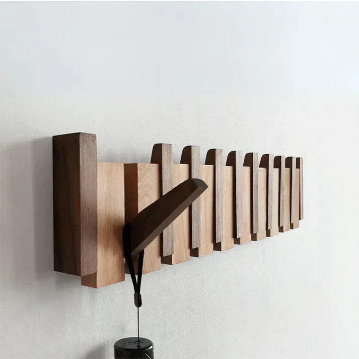 "Pianovormige houten kapstok met uniek design, vervaardigd uit hoogwaardig hout, geschikt voor jassen en accessoires."