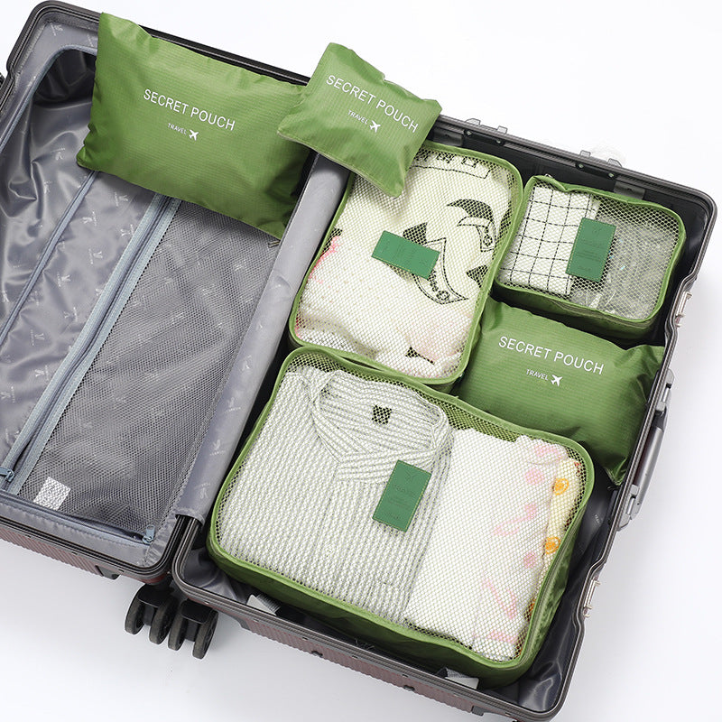 Praktische Reis Inpakblokjes Set, toont compacte organisatie en ruimtebesparing in een rugzak.