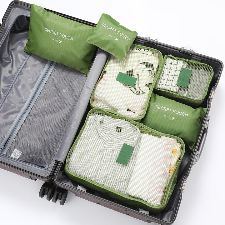 Praktische Reis Inpakblokjes Set, toont compacte organisatie en ruimtebesparing in een rugzak.