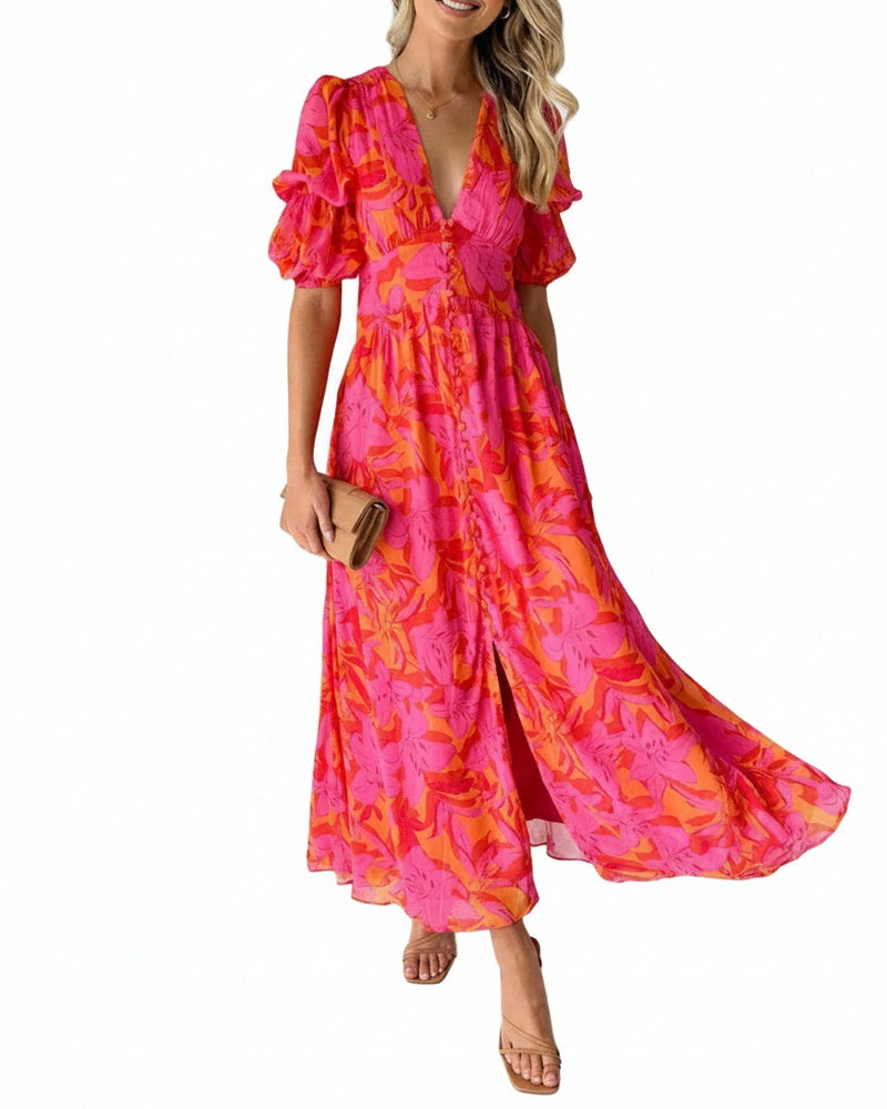 Roze dames maxi jurk met tropische print, elegante V-hals en stijlvolle pofmouwen. Perfect voor de zomer.