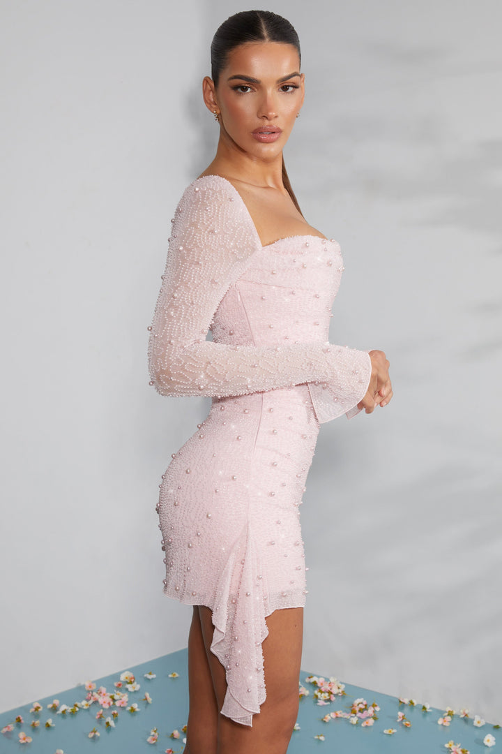 Verfijnde feestjurk voor vrouwen, roze met elegante kralen en lange mouwen, perfect voor avonden.