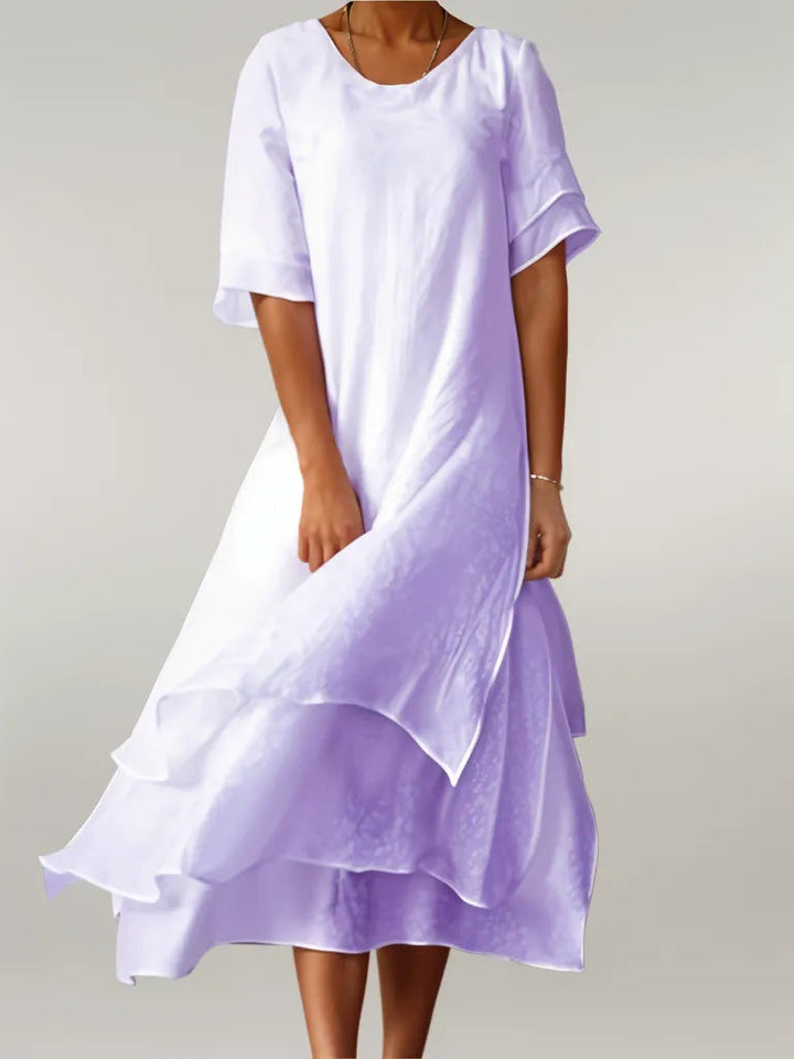 Paarse stijlvolle gelaagde zomerjurk voor dames, met vloeiende mouwen, perfect voor warme dagen.