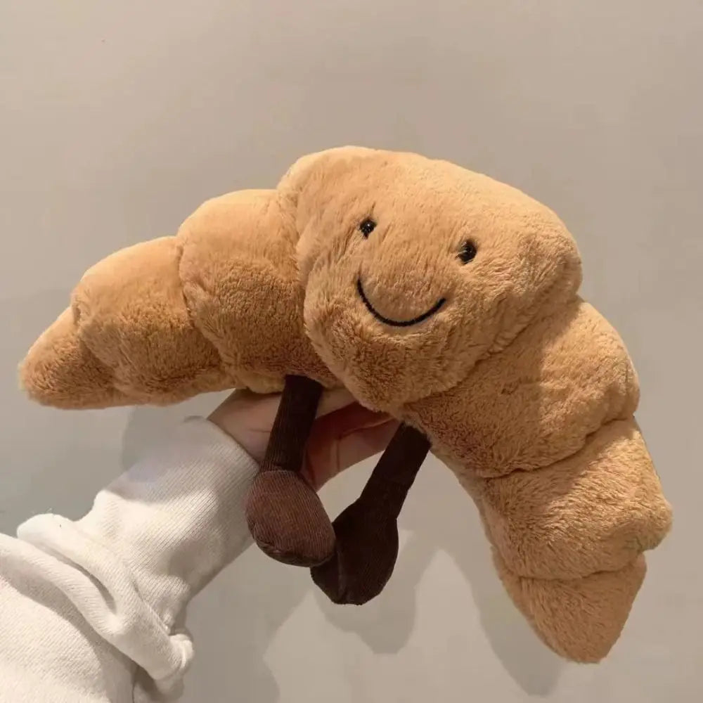 Vrolijke lachend brood knuffel, een schattig pluchen cadeau dat elk kind blij maakt.