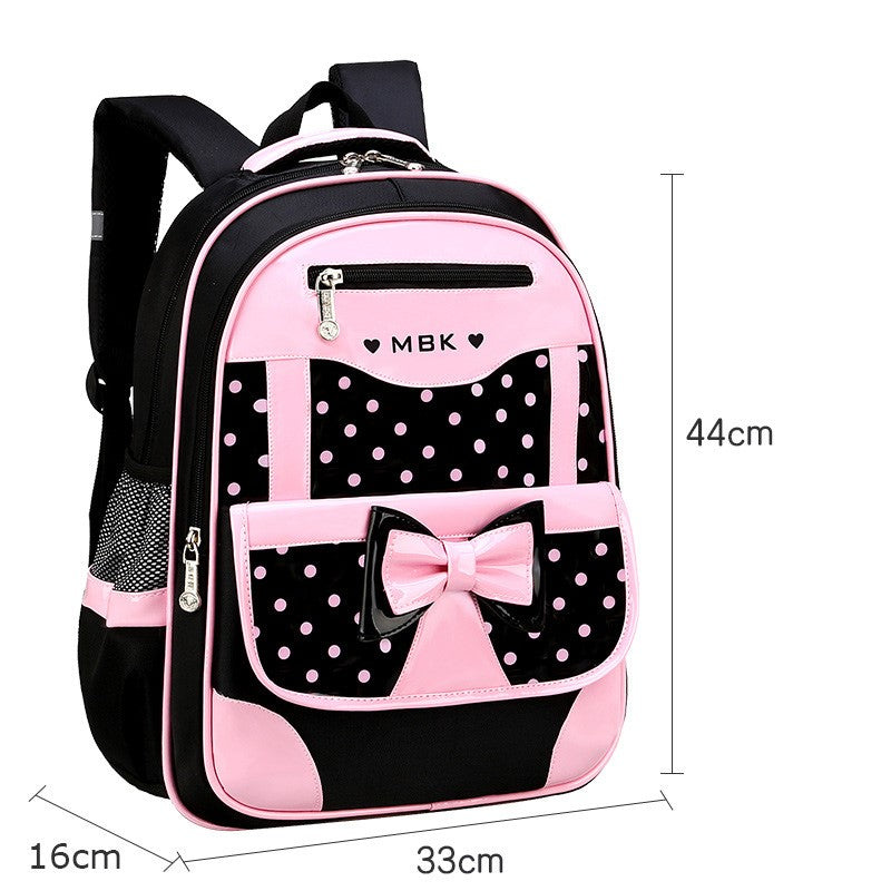 Kinder schooltas: Zwarte Shelly rugzak voor meiden met roze stippen. Ruim en waterdicht voor alle schoolspullen.