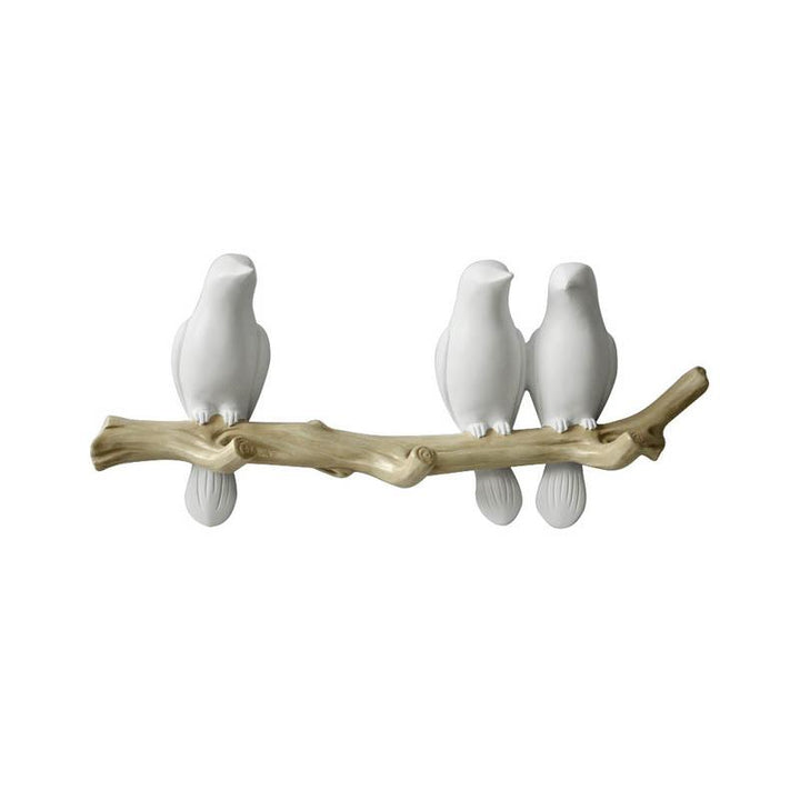 Vrolijke wandkapstok met vogelmuurhaken, een unieke toevoeging voor hal of kinderkamer.