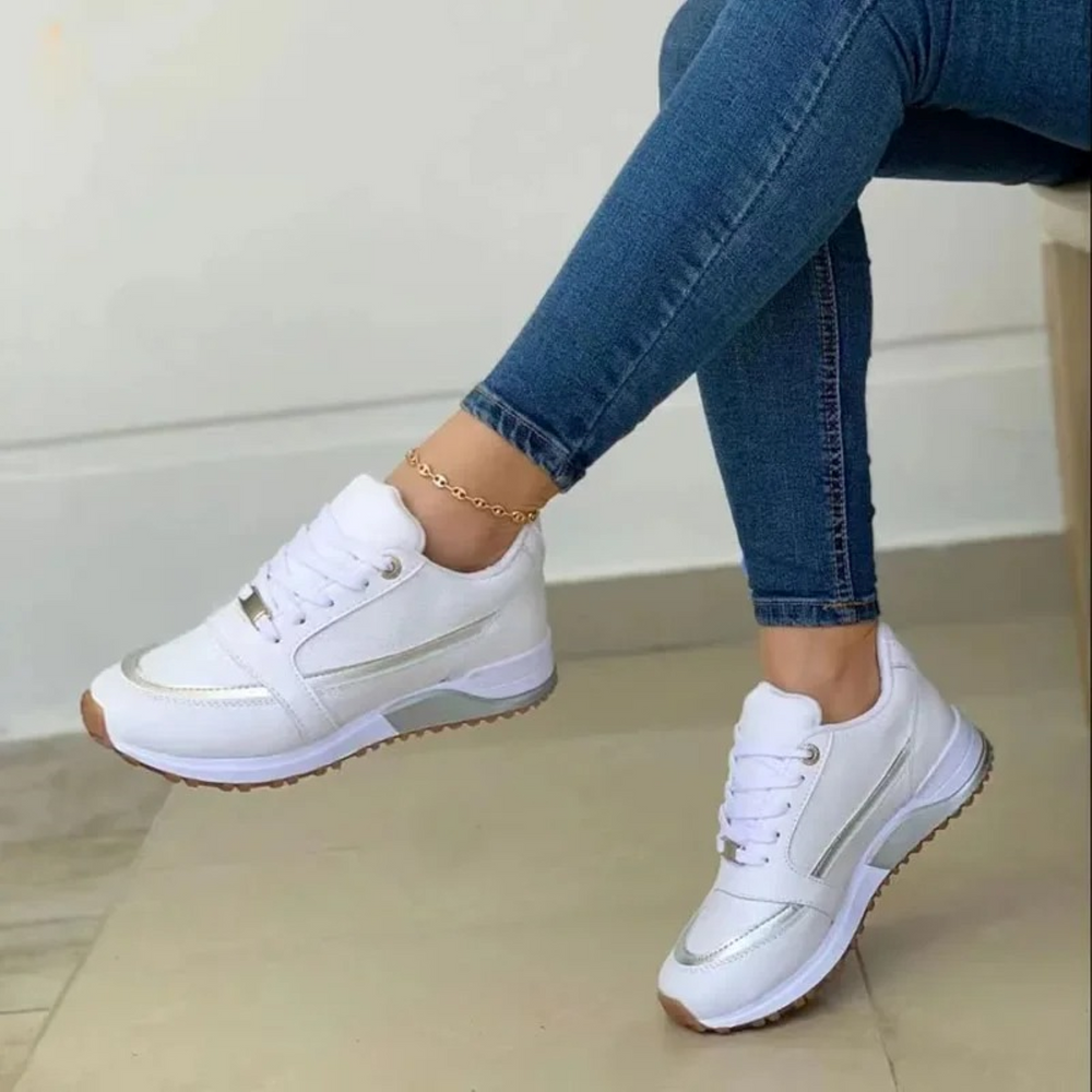 "Sportieve leren damesschoenen met zachte witte zool, elegant design in blauw, licht bruin of zwart, veelzijdig en stijlvol."