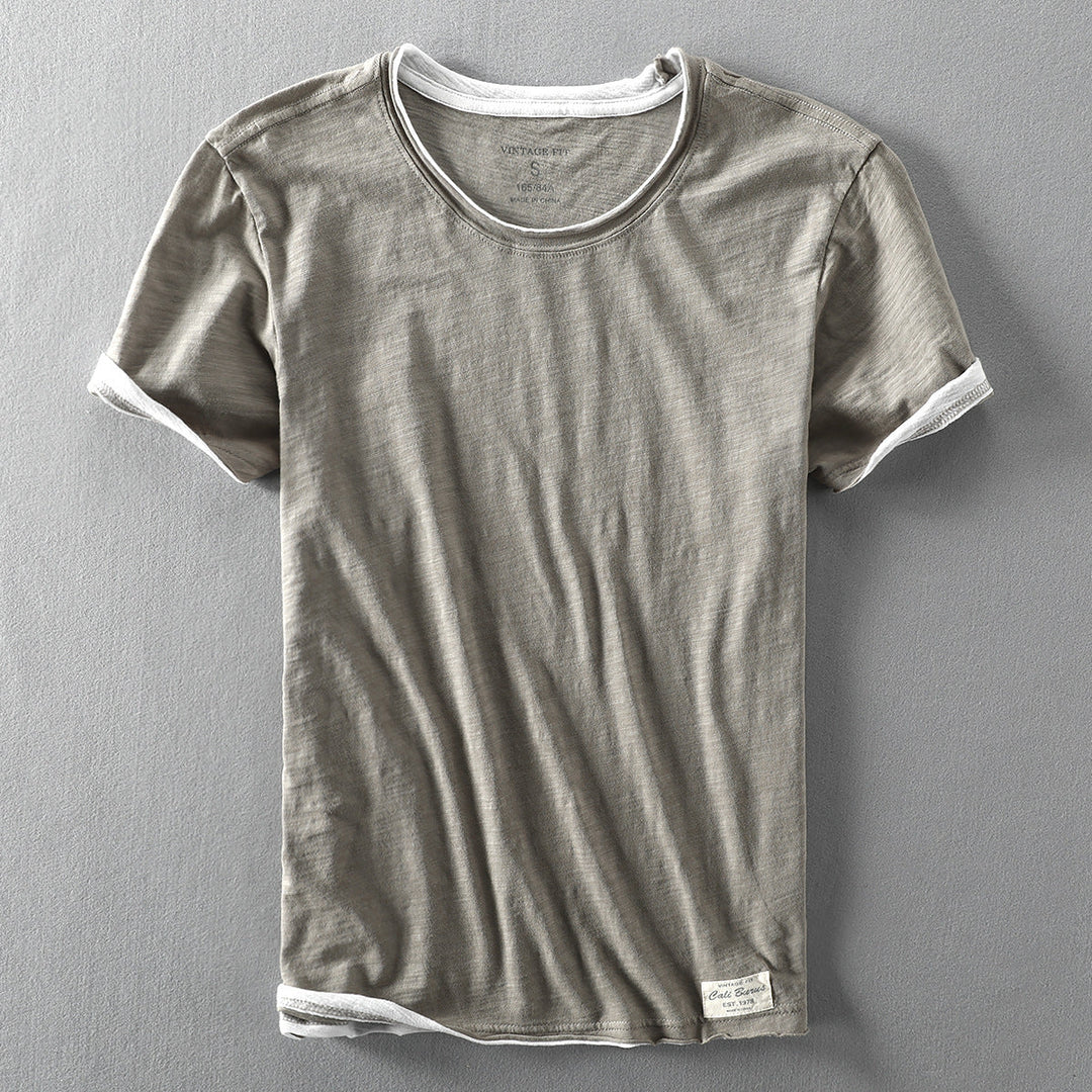 Achterkant van het heren T-shirt met vintage fit en comfortabele ronde hals. Toont de relaxte pasvorm.