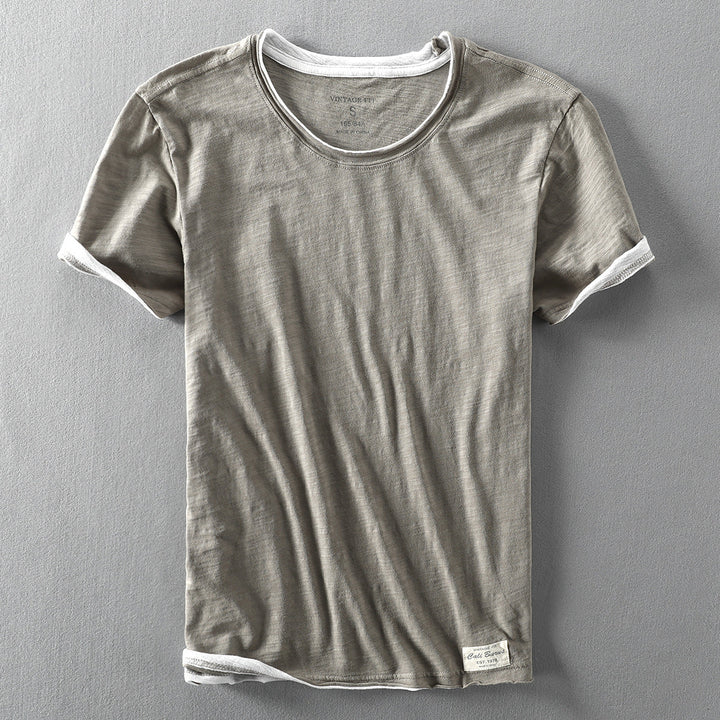 Achterkant van het heren T-shirt met vintage fit en comfortabele ronde hals. Toont de relaxte pasvorm.
