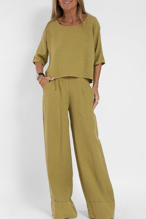 "Stijlvol katoen-linnen damespak, cropped top en wijde broek, licht ademend, ideaal voor zomer, modieus en comfortabel."