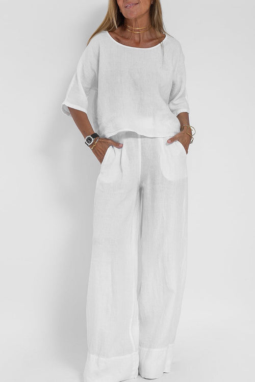 "Stijlvol katoen-linnen damespak, cropped top en wijde broek, licht ademend, ideaal voor zomer, modieus en comfortabel."