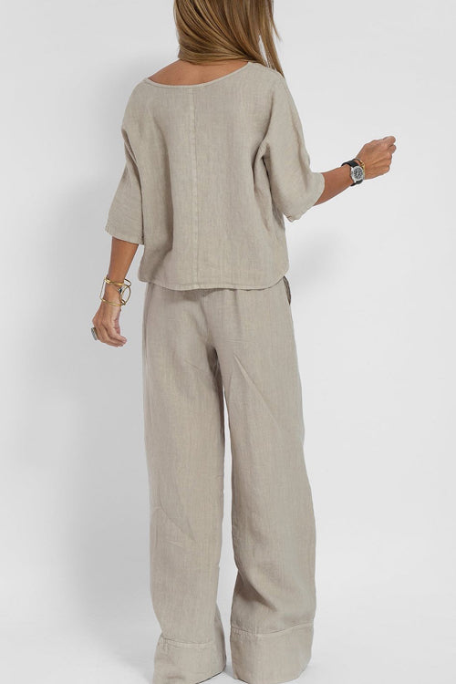"Stijlvol katoen-linnen damespak, cropped top en wijde broek, licht ademend, ideaal voor zomer, modieus en comfortabel."