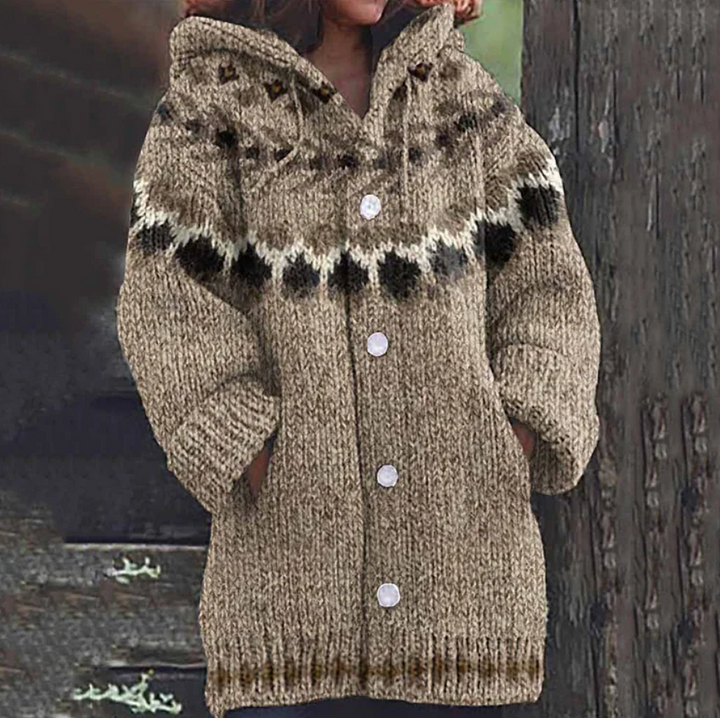 Stijlvol lang damesvest met capuchon, knoopsluiting en print. Comfortabel en tijdloos voor herfst/winter.