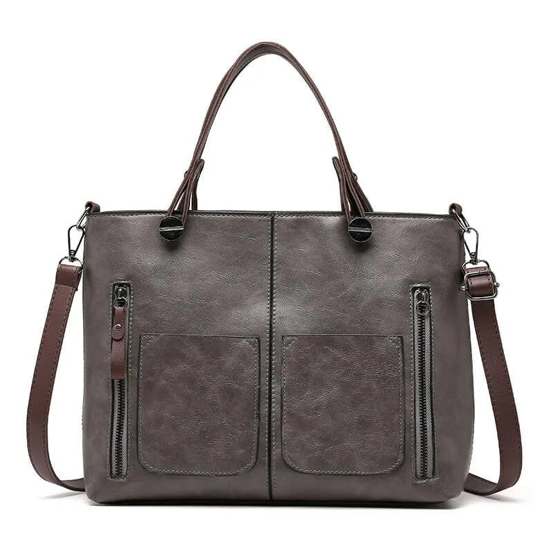 Duurzame leren schoudertas, elegant en tijdloos accessoire voor dames. Beschikbaar in bruin, zwart, grijs.