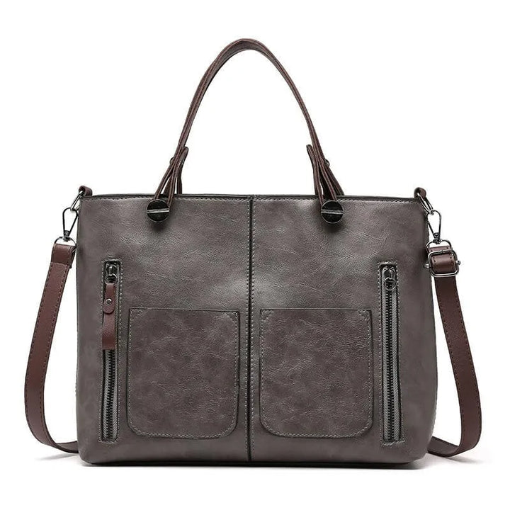 Duurzame leren schoudertas, elegant en tijdloos accessoire voor dames. Beschikbaar in bruin, zwart, grijs.