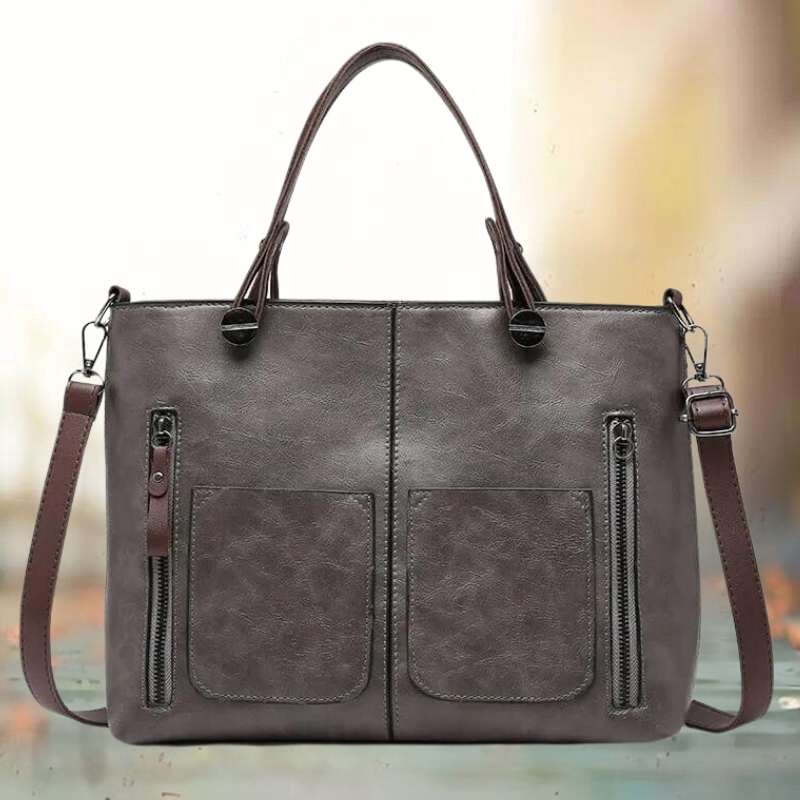 Grijze leren schoudertas voor dames, stijlvol en veelzijdig mode accessoire voor elke gelegenheid.