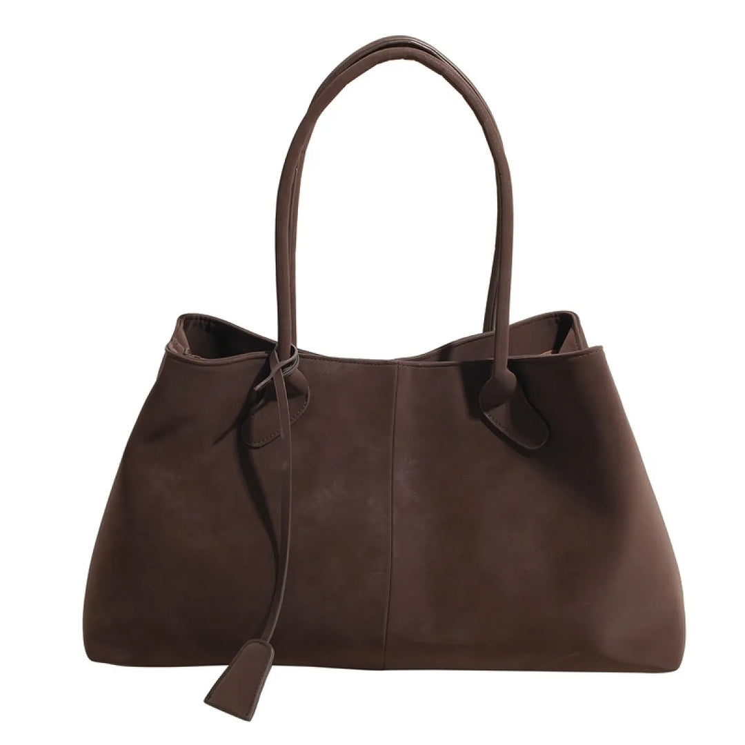 Modieuze bruine & zwarte damestas, ruime tote schoudertas. Chic en functioneel voor werk en casual outfits.