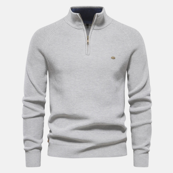 Heren halfzip sweater met ribgebreide mouwen, getoond op model. Comfortabele en stijlvolle herfst/winter pullover.