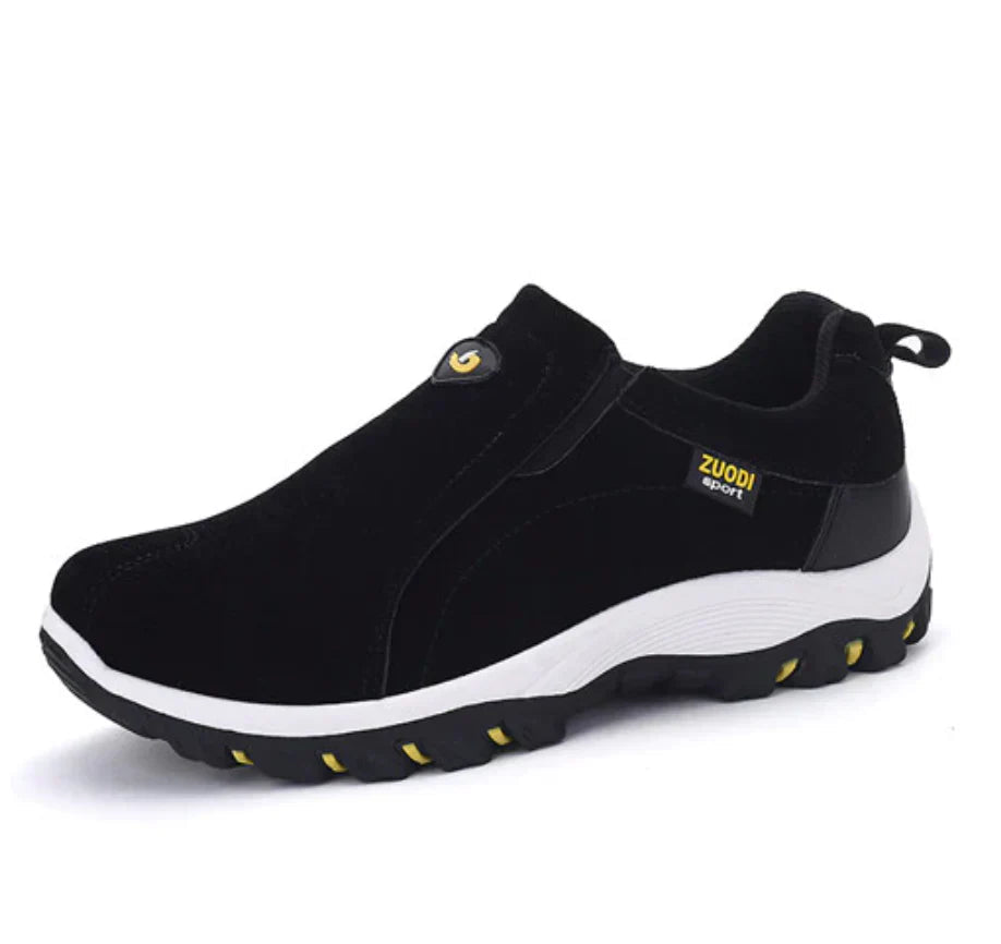 Moderne heren slip-on sneakers, zijkant. Casual sportschoenen met elastisch paneel voor comfort en stijl.