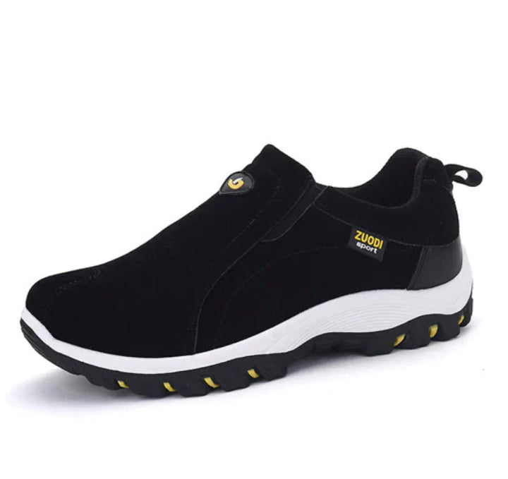 Moderne heren slip-on sneakers, zijkant. Casual sportschoenen met elastisch paneel voor comfort en stijl.