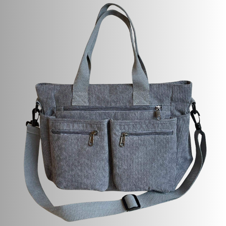 Dames schoudertas gedragen, toont hoe modieus en praktisch deze veelzijdige tas is.