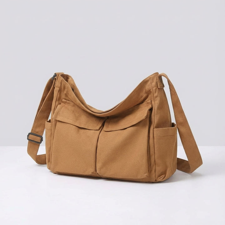 Stijlvolle unisex canvas schoudertas; functioneel als crossbody messenger voor dagelijks gemak.