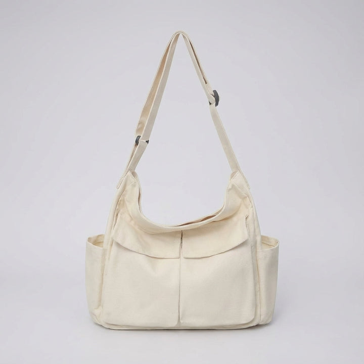 Robuuste canvas crossbody tas; duurzaam en lichtgewicht, ideaal voor dagelijks avontuur.