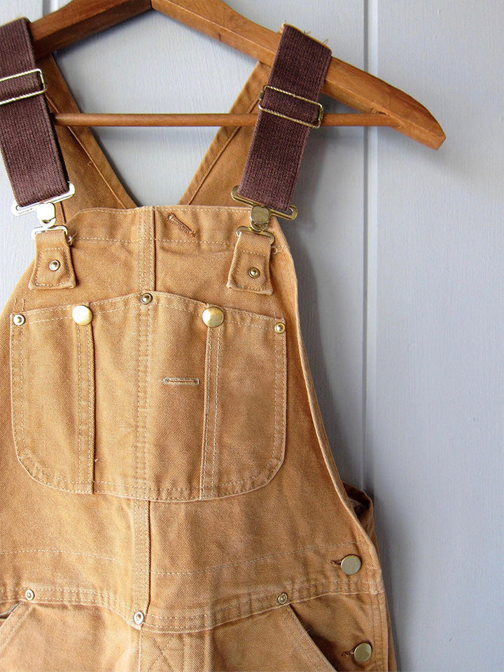 Veelzijdige unisex werkoverall van canvas, perfect voor klussen, tuinieren of als casual outfit, met bretels.