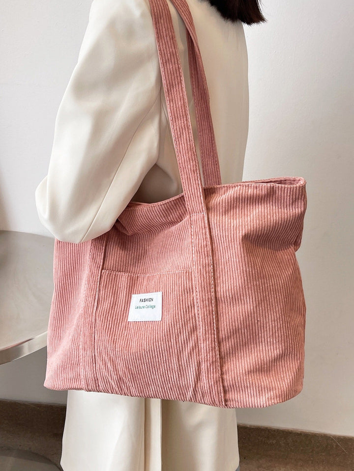 Unisex corduroy schooltas met voldoende ruimte voor laptop en boeken.