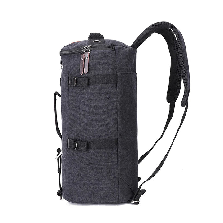 Zwarte grote capaciteit canvas reisrugzak, geschikt voor zowel mannen als vrouwen. Ideaal voor reizen en outdoor.