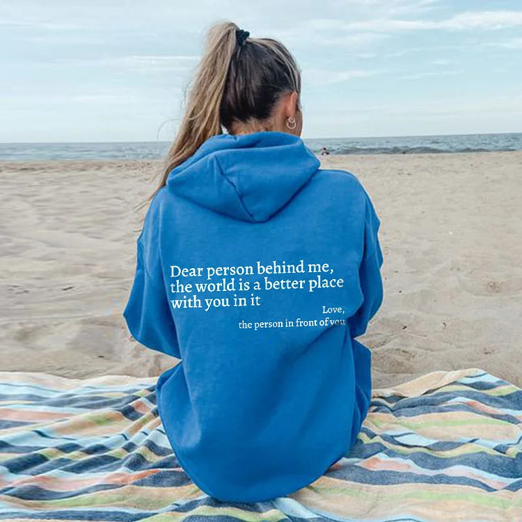 Comfortabele zwarte hoodie met positieve tekstprint 'Lieve Persoon Achter Mij'. Ideaal voor alle seizoenen.