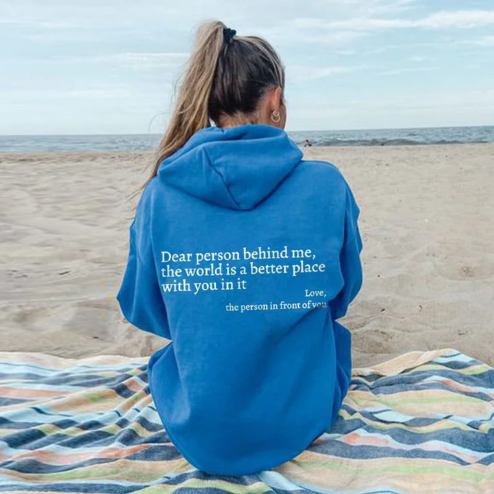 Comfortabele zwarte hoodie met positieve tekstprint 'Lieve Persoon Achter Mij'. Ideaal voor alle seizoenen.