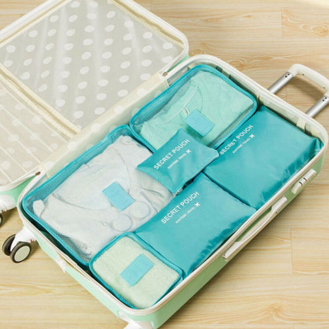 Veelzijdige set (12 stuks) van opbergtassen en organizers voor al je reisbenodigdheden en items.