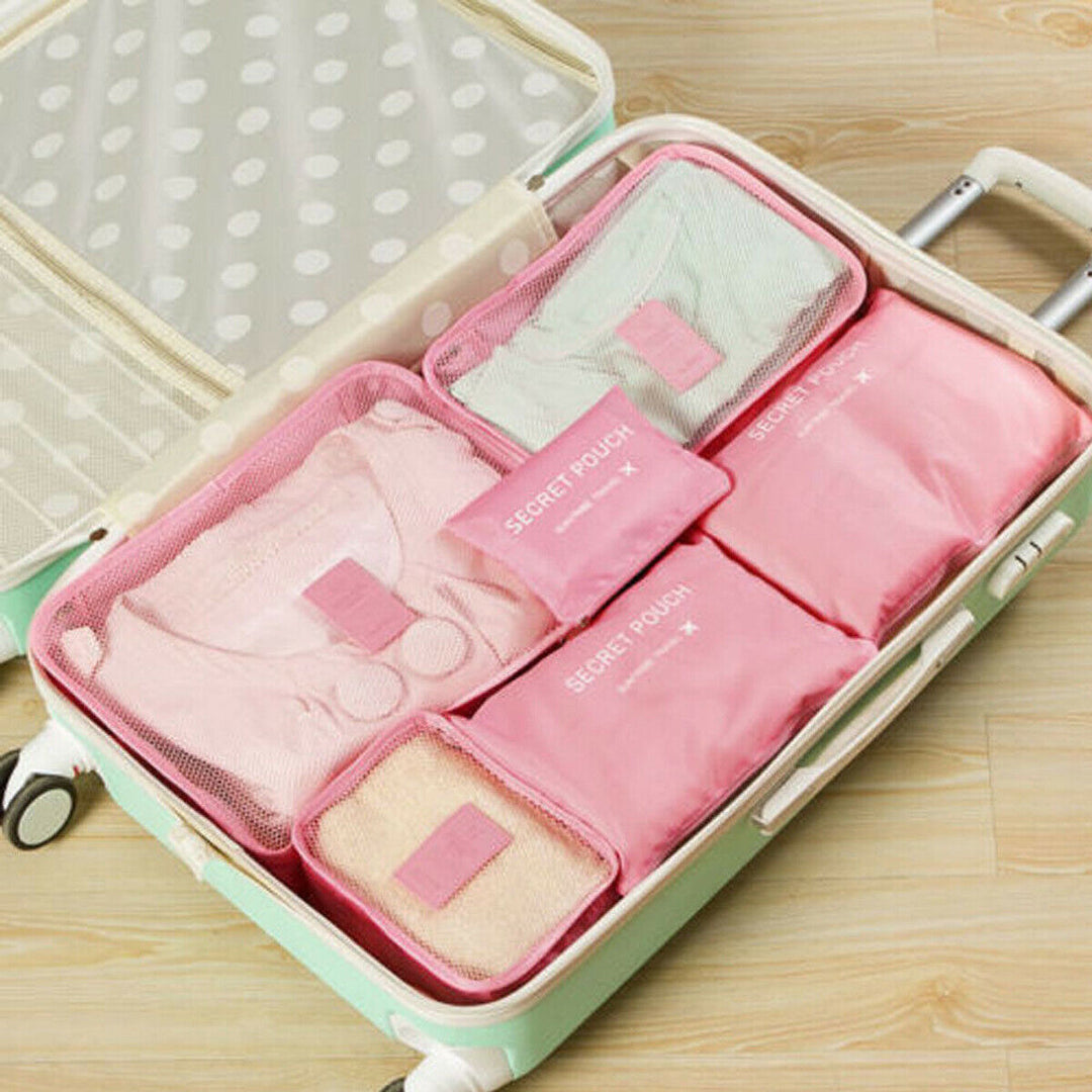 Set van 12 inpak organizers voor kleding, schoenen en toiletartikelen in je koffer en tas.