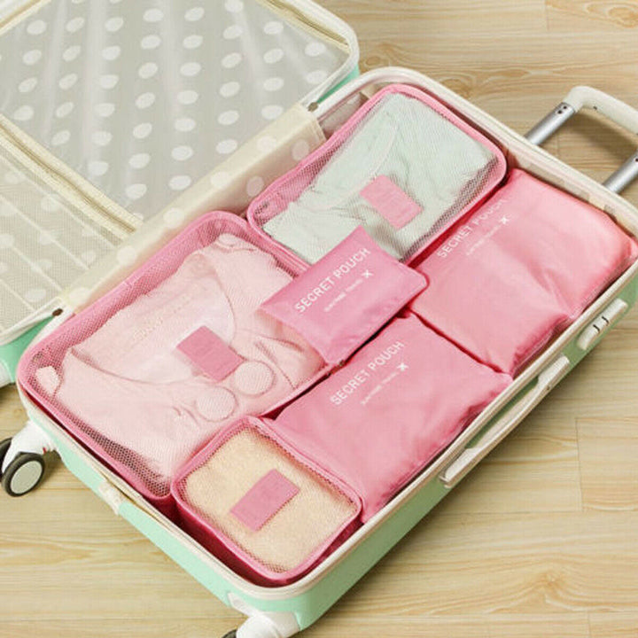 Set van 12 inpak organizers voor kleding, schoenen en toiletartikelen in je koffer en tas.