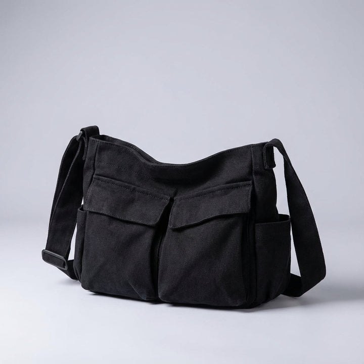 Casual unisex schoudertas in canvas, perfect voor dagelijkse benodigdheden met slimme multivakken indeling.