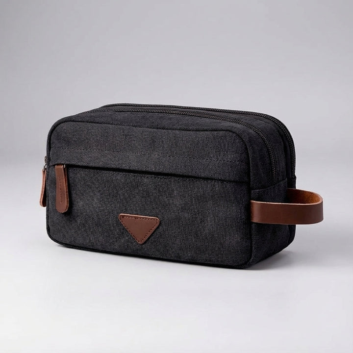 Stijlvolle Tripelle reisaccessoire: unisex toilettas met dubbel compartiment, ideaal voor badkamerbenodigdheden.