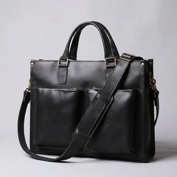Elegante unisex vintage leren laptoptas, bruikbaar als aktetas of schoudertas; stijlvol en functioneel voor werk.