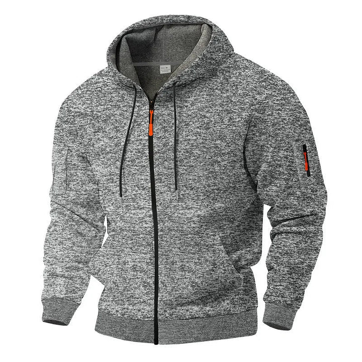 Robuust heren outdoorvest met capuchon en rits. Biedt warmte & stijl voor avontuurlijke en casual momenten.