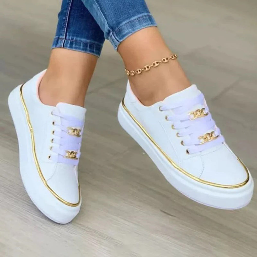 Moderne dames sneakers Luna met stijlvolle gouden accenten. Ideaal voor een elegante, casual look en dagelijks comfort.