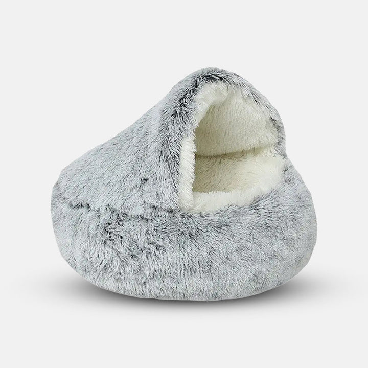Diepe slaap gegarandeerd met het pluche Cozycave grottenbed, een kalmerend toevluchtsoord voor honden.